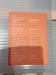 Orange plate with text listing names
